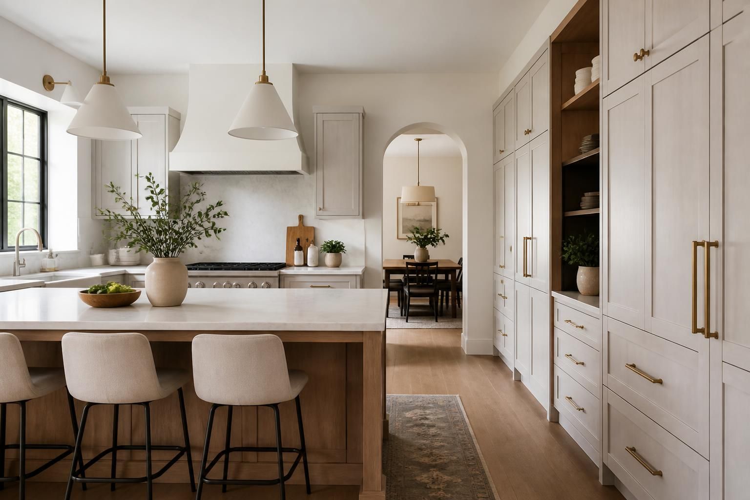 Modern kitchen with custom cabinets and a built-in pantry wall.