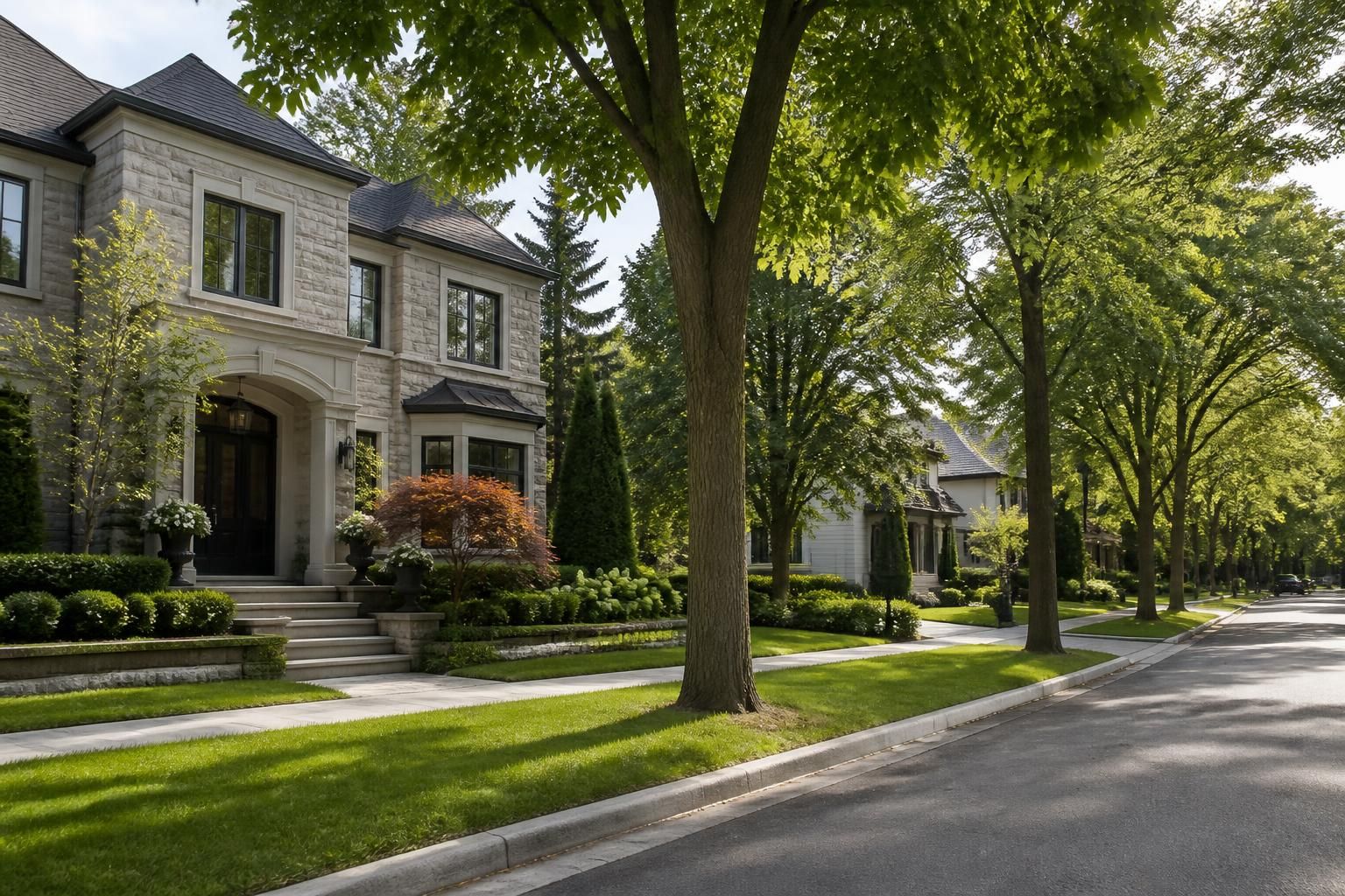 Elegant Oakville residential street with mature trees.